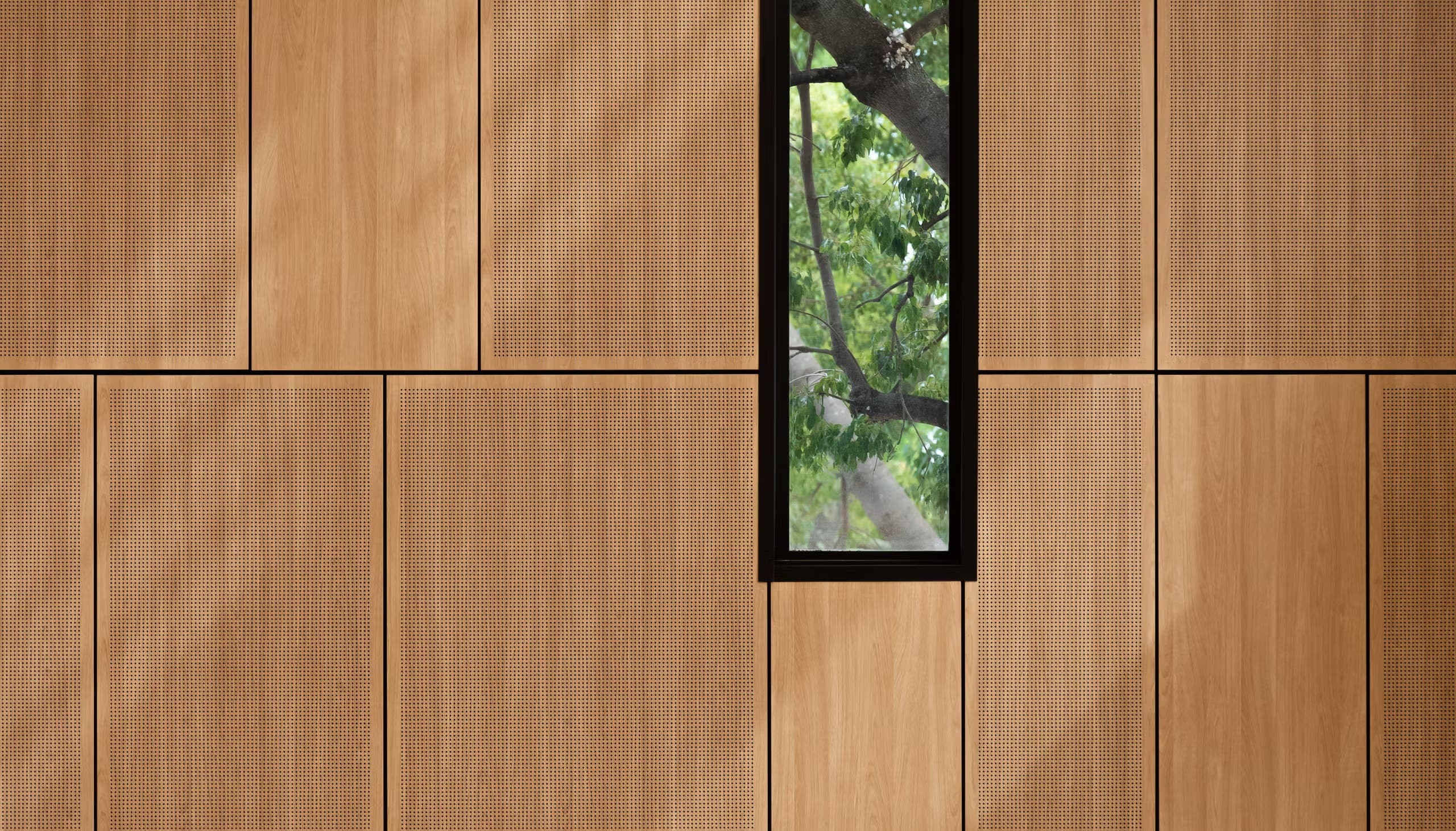 Backlit micro-perforated panel creating light effect